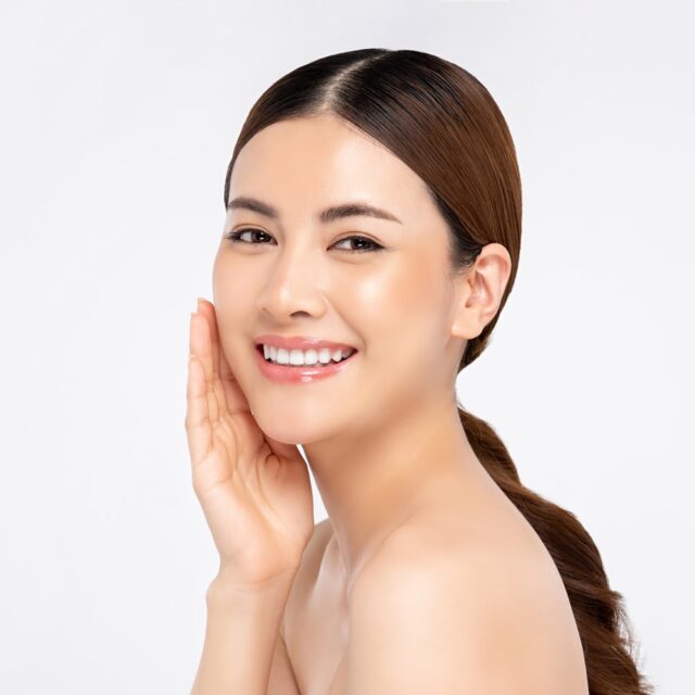 asian-woman-smiling-with-hand-touching-face-beauty-skin-care-concepts